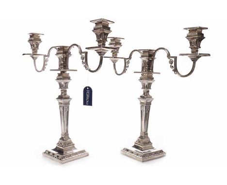 IMPRESSIVE PAIR OF VICTORIAN SILVER CANDELABRA
maker Henry Wilkinson & Co, London 1874, of square form with stepped bases and