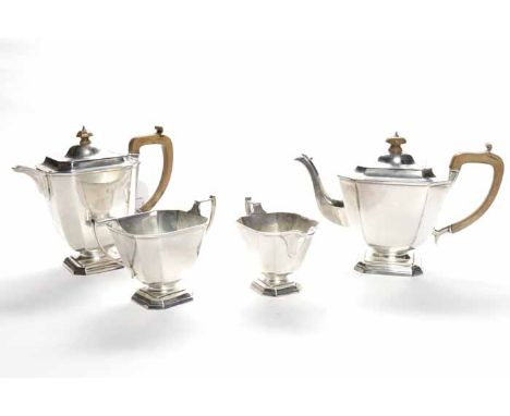 GEORGE V SILVER FOUR PIECE TEA SERVICE
maker Robert Stewart, London 1929, of tapering square form, each on a square plinth fo