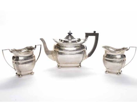 EARLY GEORGE V SILVER THREE PIECE TEA SERVICE
maker Charles Boyton & Son Ltd, London 1915 of facetted rectangular form, corne