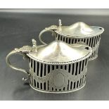 Two hallmarked silver mustards with blue glass liners by C S Harris & Sons Ltd, hallmarked for