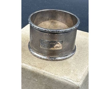 A single engraved silver napkin ring, hallmarked for Birmingham