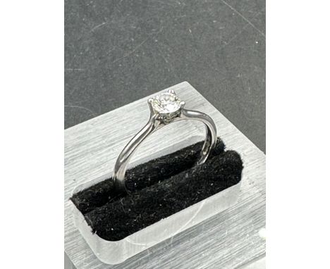 A single brilliant cut diamond, mounted in a four claw platinum ring. diamond weighing 0.36ct, colour F clarity SI1. Size M