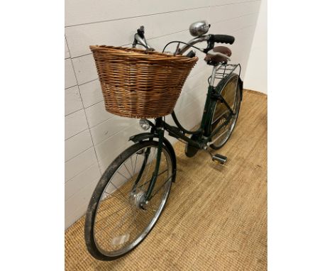 A ladies push bike by Princess, wicker basket to front and Brooks leather seat 