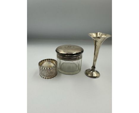 Hallmarked silver to include a napkin ring, spill vase and glass jar with silver lid 