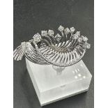 A white gold diamond spray brooch with a beautiful array of quality diamonds.
