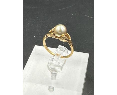An untested gold and pearl ring, approximate total weight 2.1g. Size L