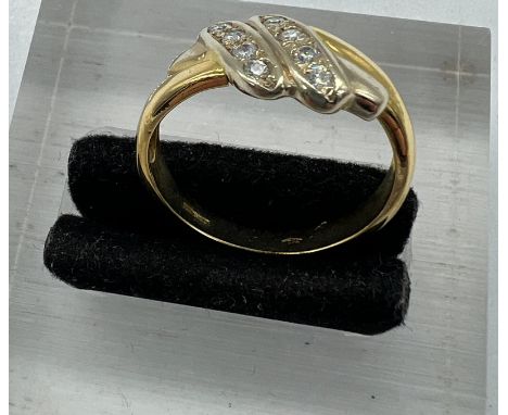 An 18ct, marked 750 diamond ring, approximate weight 4.5g, size O.