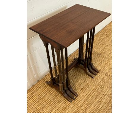 Nest of three Edwardian style mahogany nesting tables on ring turned legs (H61cm W48cm D30cm)