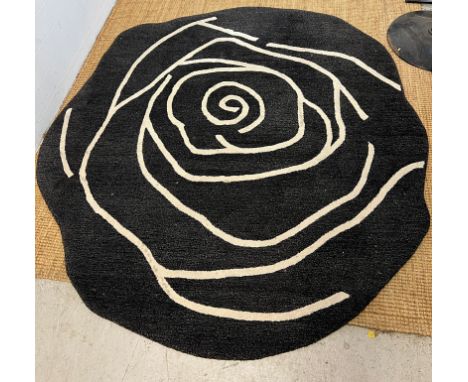 An Anna Charlotte of Stockholm carpet with black grounds in the form of a rose (196cm x 190cm)