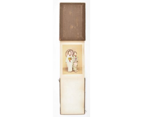 All approx. 9 x 13.5 cm. Mounted on both sides of 12 lvs. fold. in leporello between cl.-covered wooden covers, 12 x 18 cm.Wi