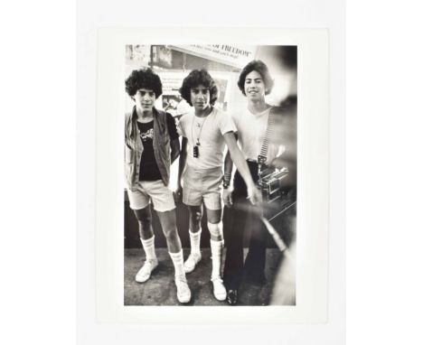 From the 42nd Street Boys series, 1979. 35 x 28 cm. Gelatin silver print, titled, dated and signed in pencil on verso below. 