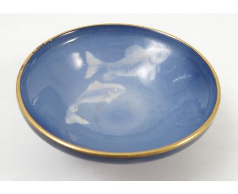 A Royal Worcester Sabrina ware bowl, decorated with two white fish to a blue ground by W H Austin, on circular pedestal foot,