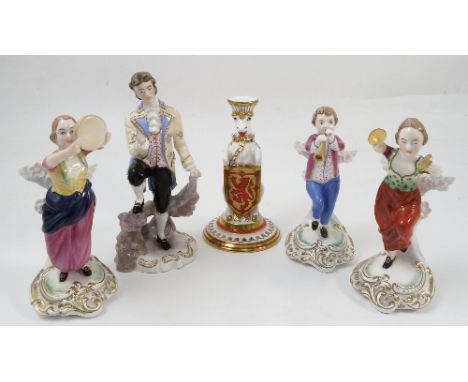 Three Spode porcelain figures, modelled as two girls and a boy playing instruments, height 7ins, together with a Royal Crown 