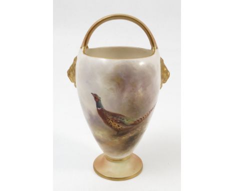 A Royal Worcester vase, with fixed blush handle, gilt lion masks and hand painted with a cock pheasant in landscape by Jas St