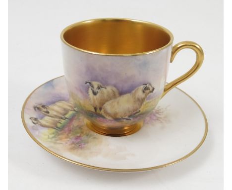 A Royal Worcester cabinet cup and saucer, the exterior of the cup and the saucer hand painted with sheep in landscape by Town