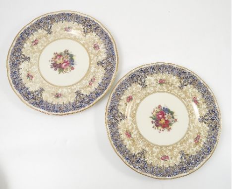 Two Royal Worcester cabinet plates, hand painted with floral sprays to the centre by Mold and Marwood, diameter 10.75ins