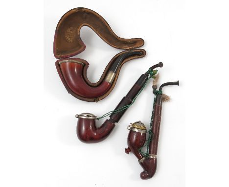 A collection of pipes, to include a cased pipe with hallmarked silver mounts and various Tyrolean briar pipes with covers to 