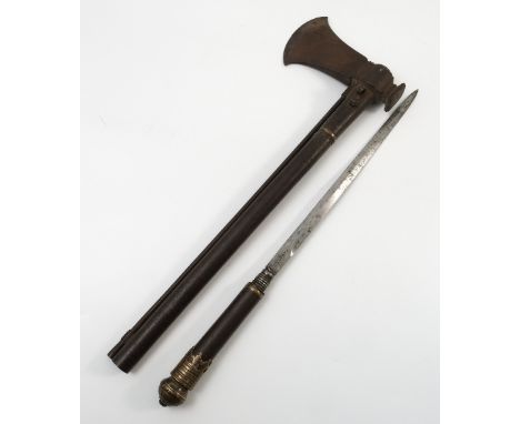 An 18th/19th century iron matchlock axe with concealed dagger, the screw out dagger with marks to the blade, with steel ram r