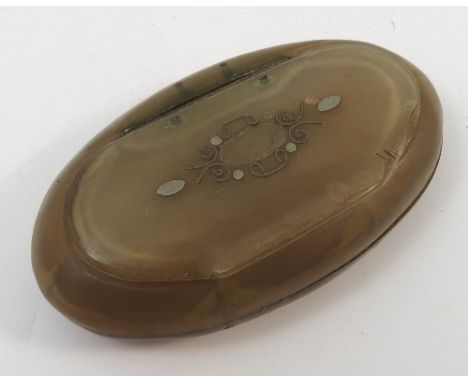 A 19th century oval horn snuff box, with inlaid cover, diameter 3ins