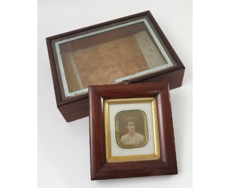 A small mahogany glass top display case, 10ins x 13ins, together with a Victorian portrait photograph in cushion frame etc