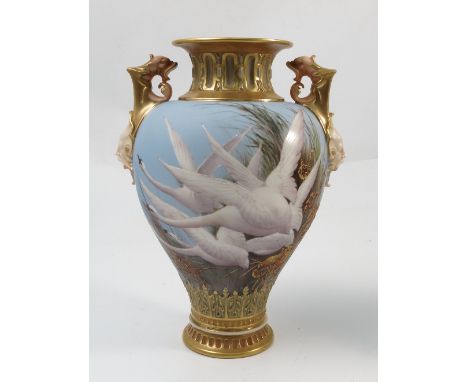 A Royal Worcester vase, decorated with swans to a powder blue ground by C H C Baldwyn, shape number 1553, circa 1910, height 