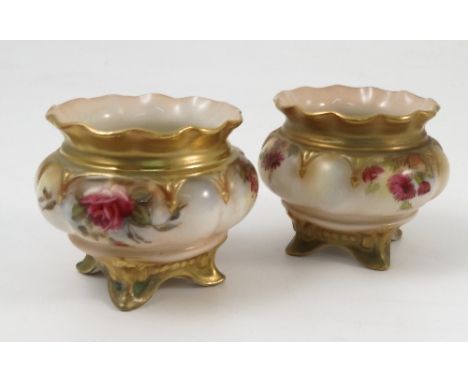 A pair of Royal Worcester vases, the shaped bodies printed painted with flowers, shape number H220, dated 1901 and 1911, heig