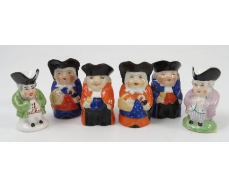 Four Royal Worcester miniature Toby jugs, two Mr Toby jugs, model number 2831 and two Mrs Toby jugs, model number 2841, heigh