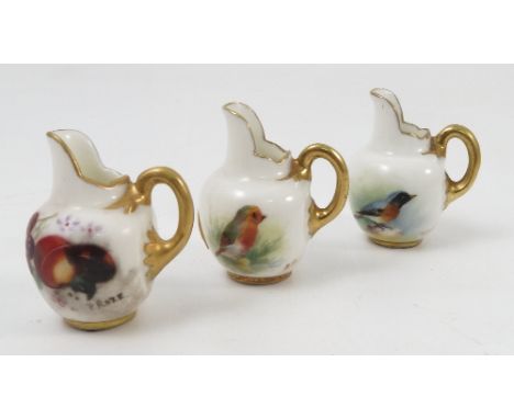 Three miniature Royal Worcester flat back jugs, two hand painted with British birds the other with fruit, signed Baker, Platt