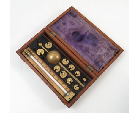 A portable two pan assay scales, Worcestershire County Council, height 11ins, mahogany cased, together with a Sike's hydromet