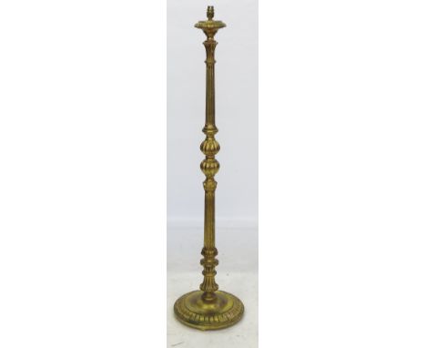 A gilt standard lamp, having fluted reeded column with circular base