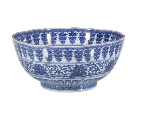  An Arita blue and white bowl  ,    decorated with bands of stylised lotus, lappets and pendant flowers, base with Chinese fo