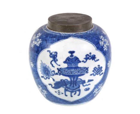  A Chinese blue and white ginger jar,   Kangxi, painted with panels of precious objects on a 'cracked-ice' and 'prunus' groun