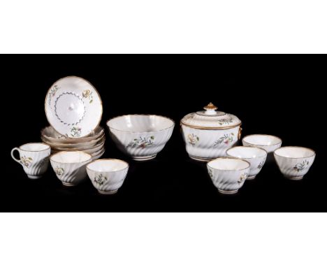  An English porcelain spirally fluted part tea service,   late 18th century, painted with coloured floral sprigs, comprising: