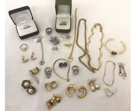 A small collection of vintage and modern costume jewellery. To include necklace and earring sets, rings, bracelets and earrin