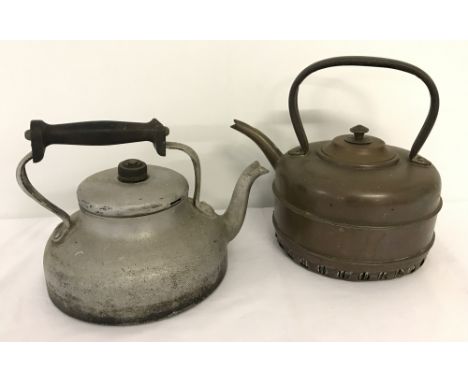 A vintage Aga aluminium stove top kettle together with a vintage gas stove copper kettle.  