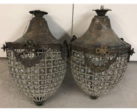 A pair of heavily beaded acorn shaped chandelier style lamp shades with floral swag detail.  Approx. 50cm tall.