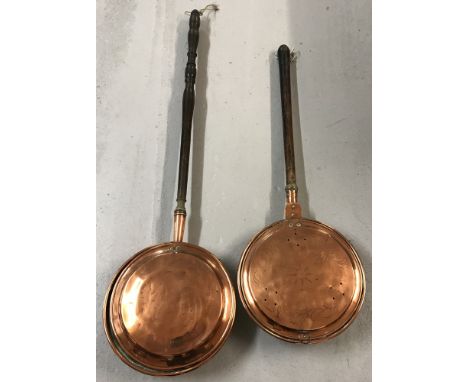 2 vintage copper warming pans with hammered detail to lids and wooden handles.  Longest approx. 110cm.