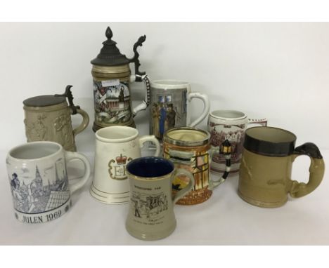 A collection of assorted ceramic tankards and steins. To include: Bavarian porcelain, Delft, Denby Stoneware with greyhound s