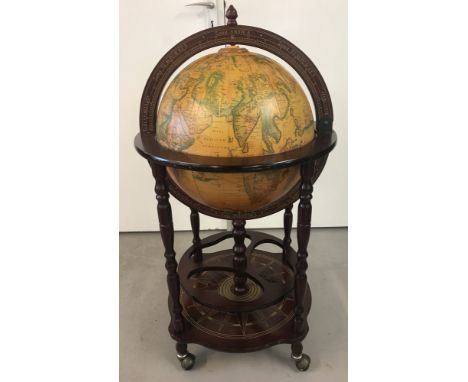 A vintage wooden framed drinks globe trolley. With bottle holders to under shelf and to interior of globe, with lift up, hing
