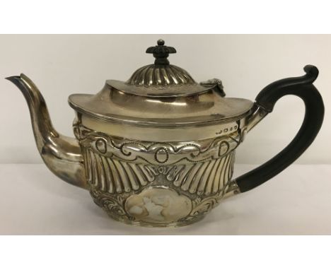 An antique silver teapot with classic decoration to both body and lid. Hallmarked Birmingham 1893.  Total weight approx. 416g