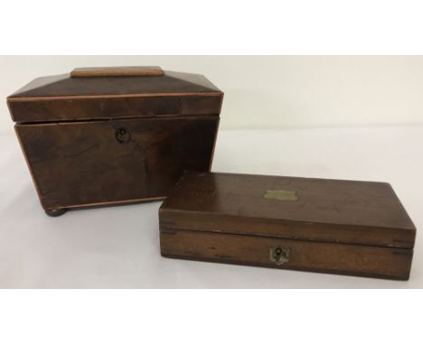 A small wooden sarcophagus shaped tea caddy. With internal lids &amp; inscription in lid dated 1920. Together with a wooden b