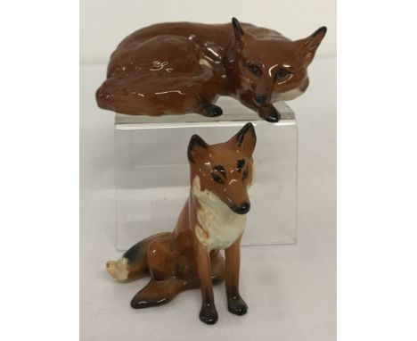 2 Beswick ceramic foxes in gloss finish. Fox curled #1017 with circular backstamp together with fox seated #1748 with oval ba