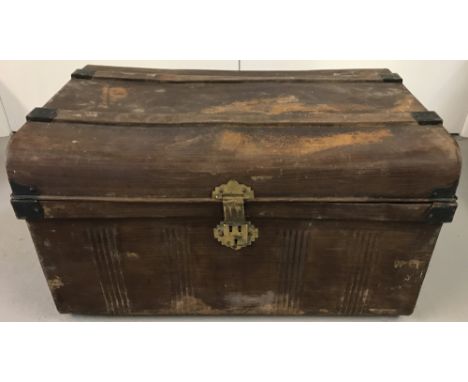 A Victorian metal travelling trunk with carry handles and brass latch/lock fixings.  Approx. 70cm x 46cm x 39cm.