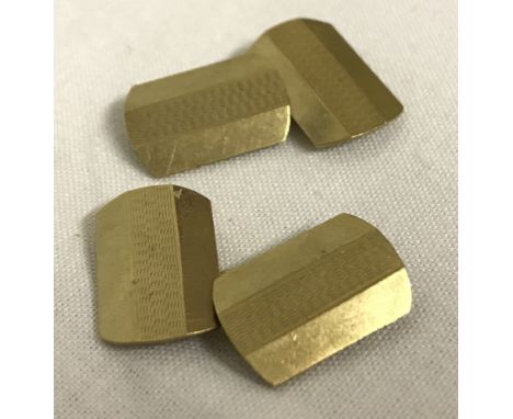A pair of 9ct gold cufflinks with engine turned decoration. Full hallmarks to back.  Total weight approx. 4.5g.