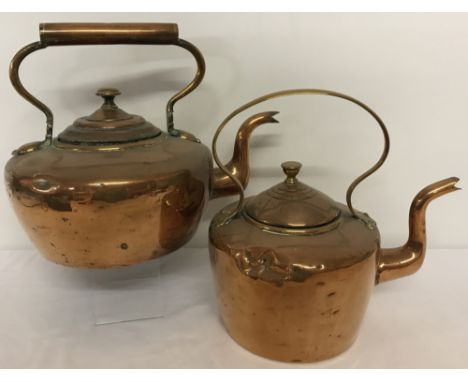 2 vintage copper kettles, one dented.  Largest approx. 27cm tall x 24cm diameter.
