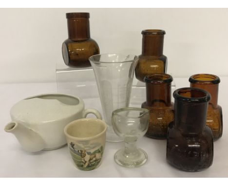 5 vintage brown glass Bovril jars. Together with a ceramic invalid cup, a glass eye bath, a ceramic Escoffier of London eggcu