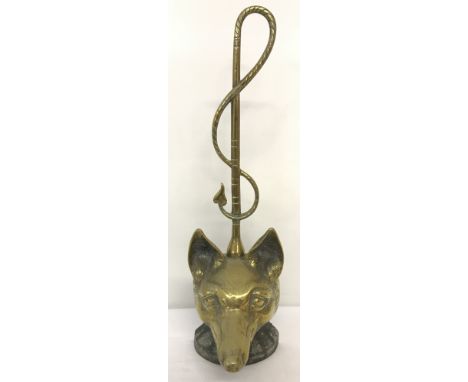 A vintage brass weighted door stop in the shape of a fox head.  Approx. 45cm tall.