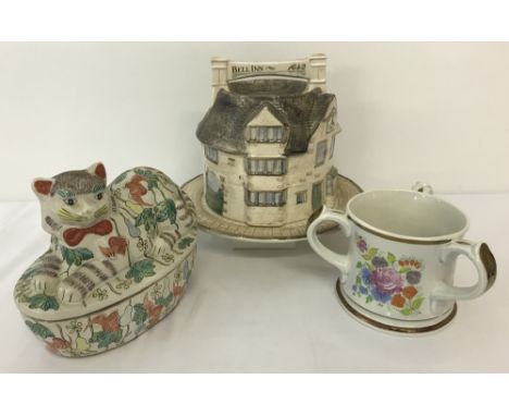 3 large ceramic items. A cheese dish of The Bell Inn, Stilton, Cambridgeshire. Together with a Ltd edition 1978 Wade, 3 handl
