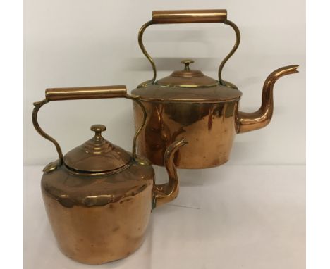 2 vintage copper kettles.  Largest approx. 27cm tall.