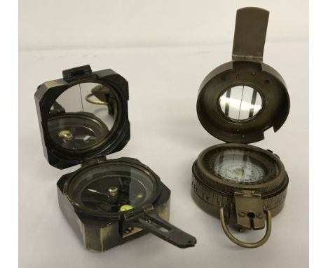 2 brass cased compasses. A square shaped compass with mirrored interior to lid, marked Kelvin &amp; Hughes, London, 1917. Tog